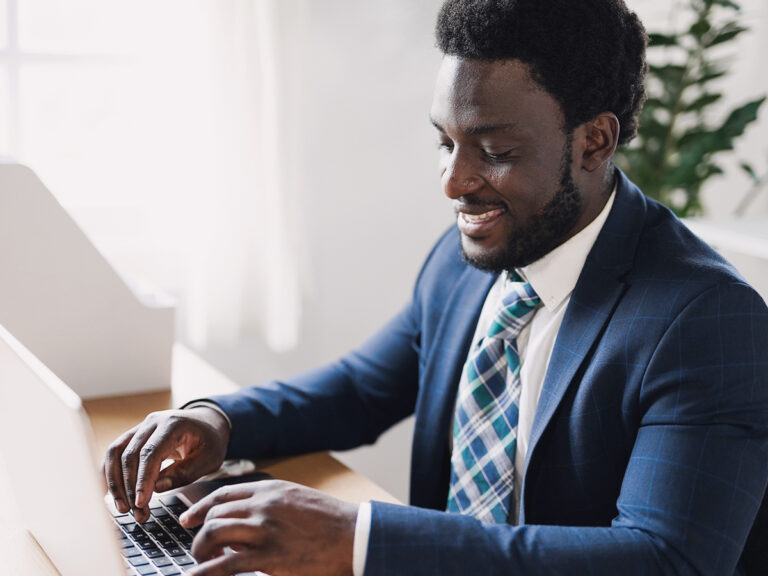 He works on a medical record audit using his laptop